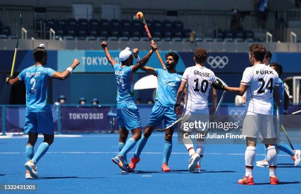 Dilpreet Singh and Mandeep Singh of Team India react after being awarded a penalty shot during the Men's Bronze medal match between Germany and India...