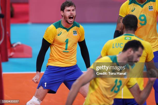 Mossa Rezende Bruno of Team Brazil celebrates with teammates after the play against Team ROC during the Men's Semifinals volleyball on day thirteen...