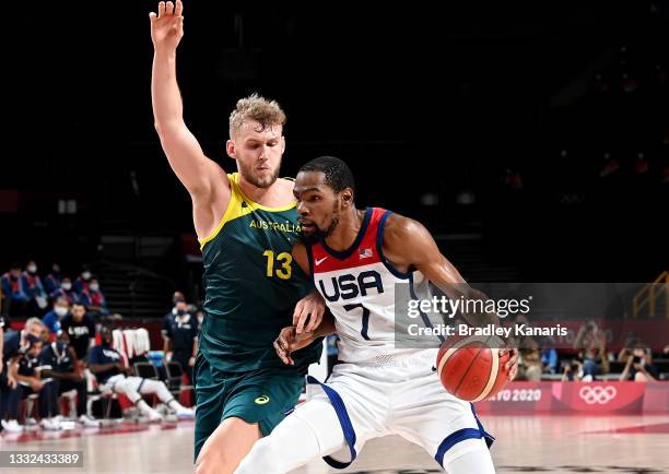 Kevin Durant of the USA takes on the defence of Jock Landale of Australia during the Basketball semi final match between Australia and the USA on day...