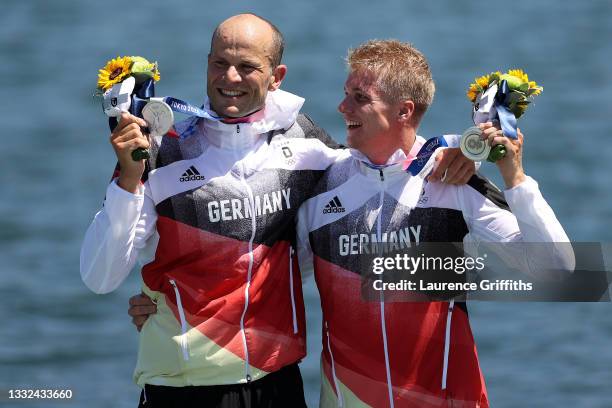 Silver medalists Max Hoff and Jacob Schopf of Team Germany celebrate at the medal ceremony following the Men's Kayak Double 1000m Final A on day...