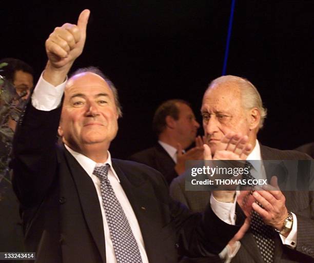 Swiss FIFA secretary general Sepp Blatter gives the thumbs-up, 08 June during the 51st FIFA congress in Paris, after being elected new FIFA president...