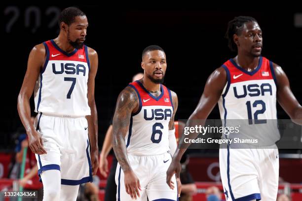 Kevin Durant, Damian Lillard and Jrue Holiday of Team United States look on against Team Australia during the second half of a Men's Basketball...
