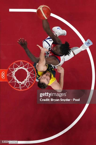 Jrue Holiday of Team United States drives to the basket against Nic Kay of Team Australia during the second half of a Men's Basketball quarterfinals...