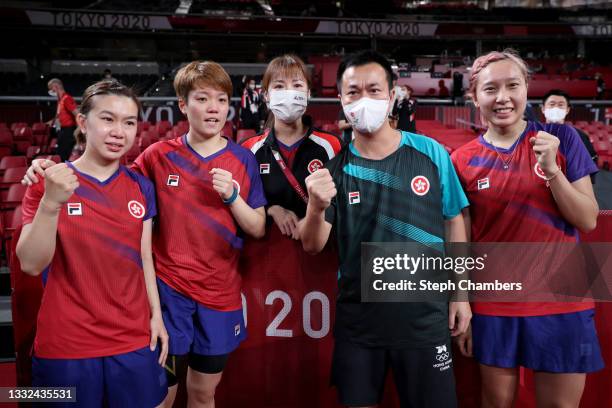 Team Hong Kong table tennis players Lee Ho Ching , Doo Hoi Kem and Minnie Soo of Team Hong Kong pose with their coaches Zhang Rui and Li Ching after...