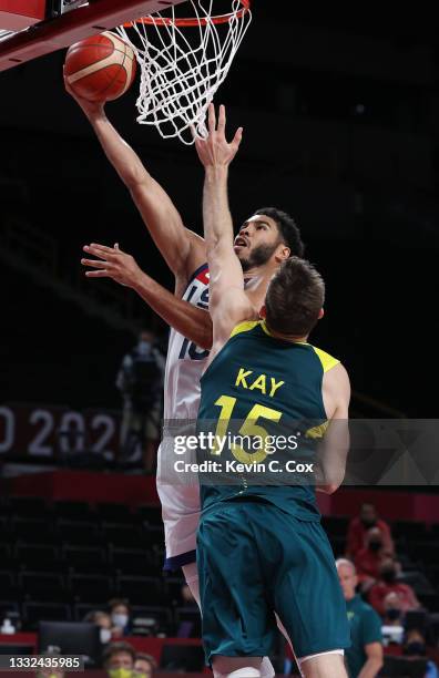 Jayson Tatum of Team United States drives to the basket against Nic Kay of Team Australia during the second half of a Men's Basketball quarterfinals...