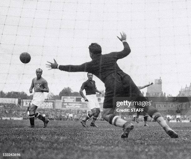 Hungarian goalkeeper Antal Szabo tries to stop a shot from Italian forward Giovanni Ferrari during the World Cup final between Italy and Hungary 19...