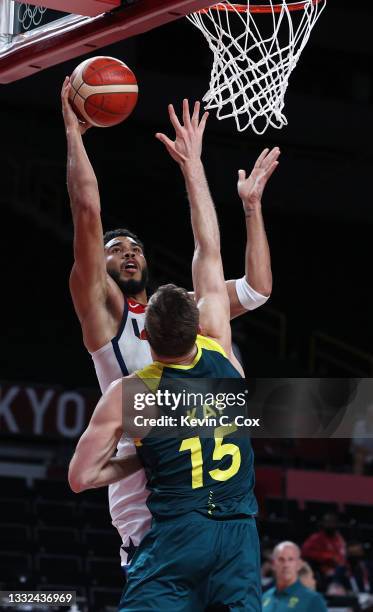 Jayson Tatum of Team United States drives to the basket against Nic Kay of Team Australia during the second half of a Men's Basketball quarterfinals...