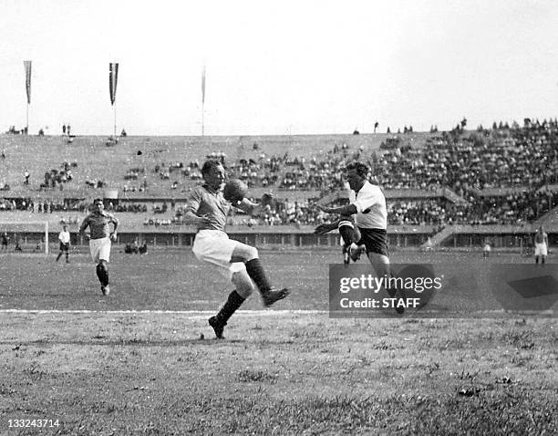 French defender Jacques Mairesse blocks the shot of Austrian forward Anton Schall during the World Cup first round soccer match between Austria and...