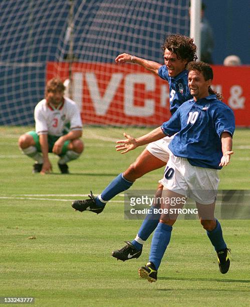 Italian striker Roberto Baggio and captain Paolo Maldini celebrate after Baggio scored his team's first goal against Bulgaria during their World Cup...
