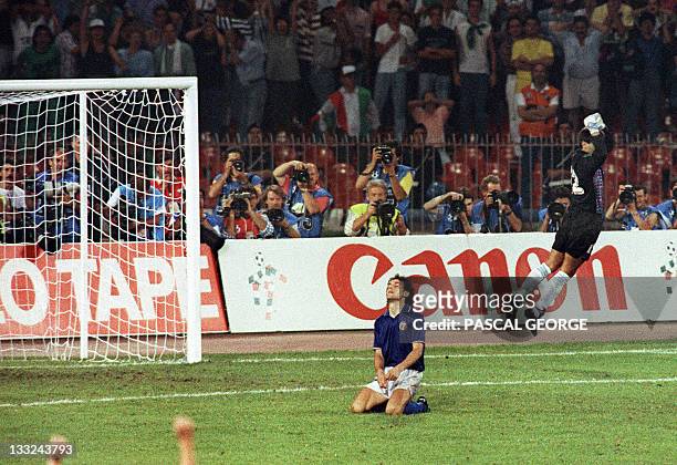 Argentinian goalkeeper Sergio Goycochea celebrates after stopping the penalty kick of Italian Roberto Donadoni during the penalty shootout of the...