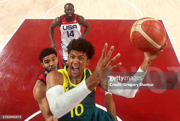 Matisse Thybulle of Team Australia goes up for a shot against Jayson Tatum of Team United States during the first half of a Men's Basketball...