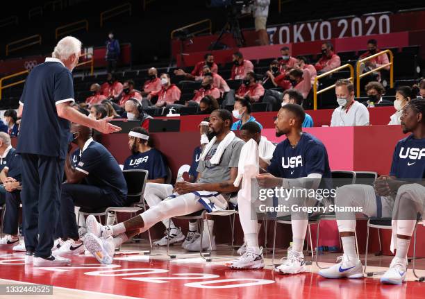 Team United States Head Coach Gregg Popovich speaks to Kevin Durant and Damian Lillard on the bench during the second half of a Men's Basketball...