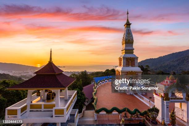 beautiful sunset at "doi thep nimit monastery" temple on the top of patong hill, phuket - phuket stock pictures, royalty-free photos & images