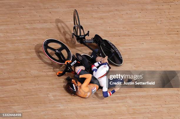 Laurine van Riessen of Team Netherlands and Katy Marchant of Team Great Britain fall during the Women's Keirin quarterfinals - heat 1 of the track...