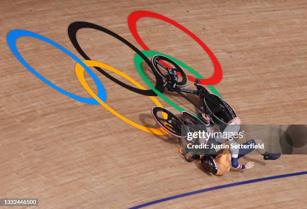 Laurine van Riessen of Team Netherlands and Katy Marchant of Team Great Britain fall during the Women's Keirin quarterfinals - heat 1 of the track...