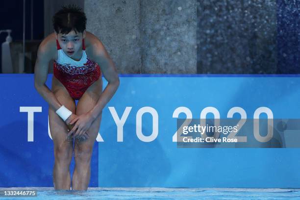 Hongchan Quan of Team China celebrates after winning the gold in the Women's 10m Platform Final on day thirteen of the Tokyo 2020 Olympic Games at...