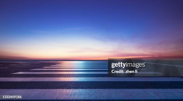 asphalt road against skyline at night - street dusk stock pictures, royalty-free photos & images