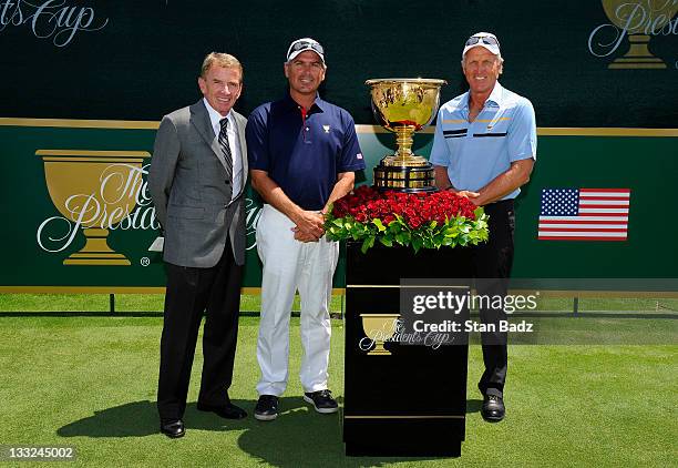 Commissioner, Tim Finchem, U.S. Team captain, Fred Couples and International Team captain, Greg Norman pose with the Presidents Cup trophy on the...