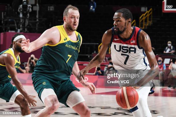 Kevin Durant of Team United States controls the ball against Joe Ingles of Team Australia during the Men's Basketball Semifinal match between USA and...