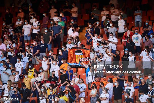 Fans cheer up on their return to the stadium during the pre-season friendly match and Trofeo Taronja between Valencia CF and AC Milan at Estadi de...