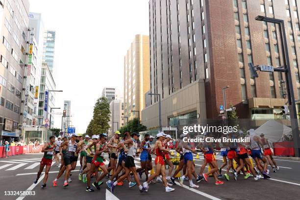 Athletes round a bend during the Men's 20km Race Walk on day thirteen of the Tokyo 2020 Olympic Games at Sapporo Odori Park on August 05, 2021 in...