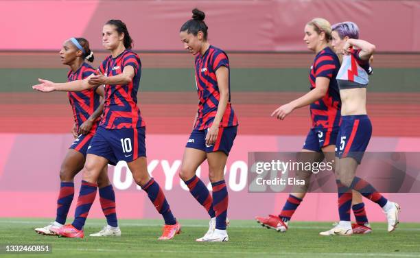 Carli Lloyd of Team United States celebrates with Crystal Dunn and Christen Press after scoring their side's third goal during the Women's Bronze...