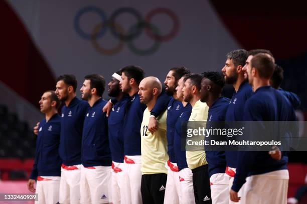 Team France stand for their national anthem ahead of the Men's Semifinal handball match between France and Egypt on day thirteen of the Tokyo 2020...