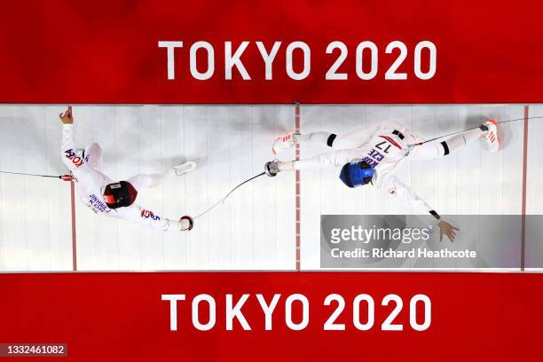 Jinhwa Jung of Team South Korea and Jan Kuf of Team Czech Republic during the Fencing Ranked Round of the Men's Modern Pentathlon on day thirteen of...