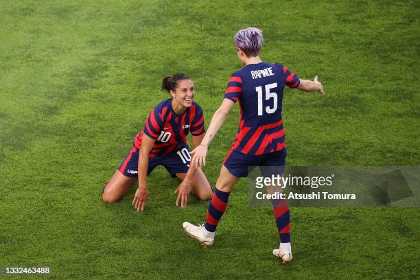Carli Lloyd of Team United States celebrates with Megan Rapinoe after scoring their side's fourth goal during the Women's Bronze Medal match between...