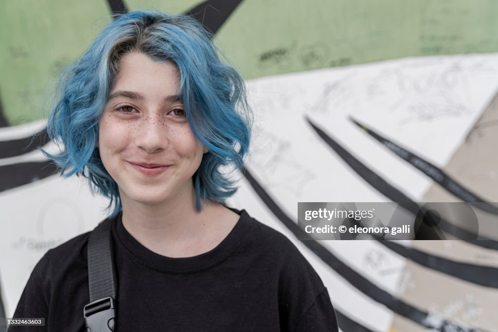 Portrait teenager with blue hair