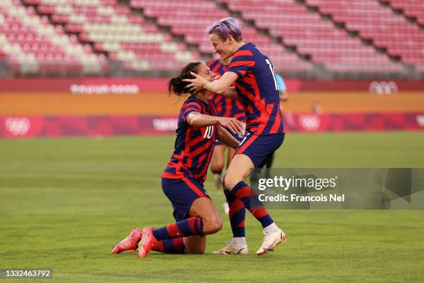 Carli Lloyd of Team United States celebrates with Megan Rapinoe after scoring their side's fourth goal during the Women's Bronze Medal match between...