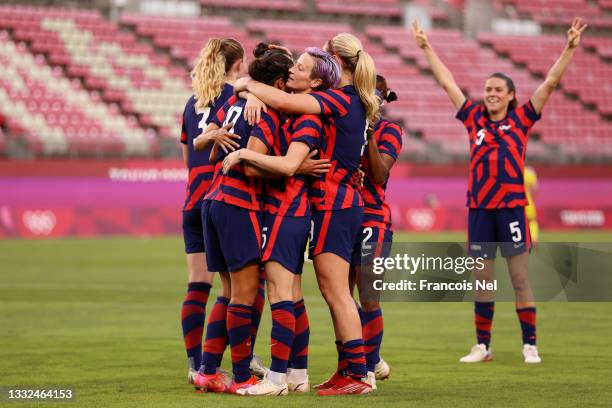 Carli Lloyd of Team United States celebrates with team mates after scoring their side's fourth goal during the Women's Bronze Medal match between...