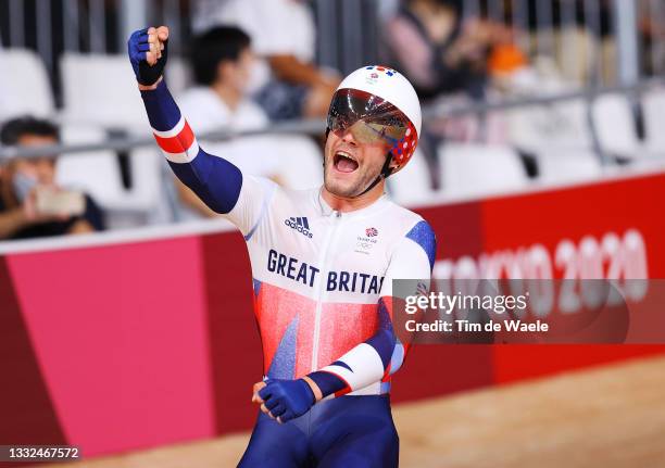 Matthew Walls of Team Great Britain celebrates winning a gold medal during the Men's Omnium points race, 4 round of 4 of the track cycling on day...