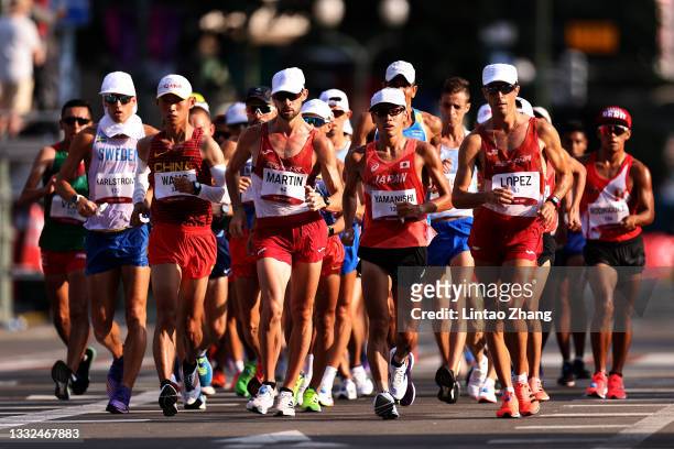 Kaihua Wang of Team China, Alvaro Martin of Team Spain, Toshikazu Yamanishi of Team Japan and Miguel Angel Lopez of Team Spain lead the field during...