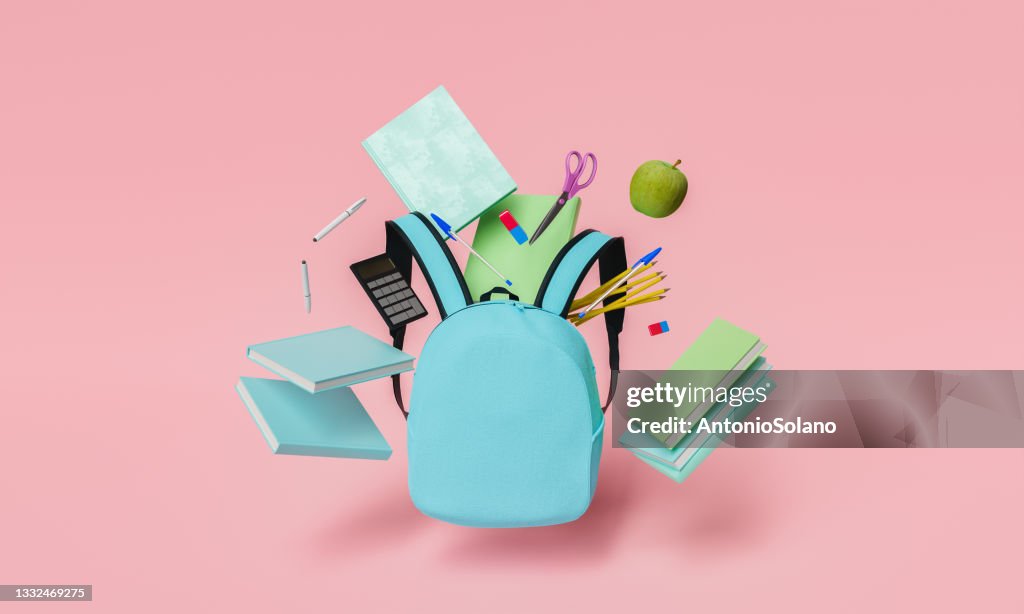 School supplies floating with blue backpack and red pastel background