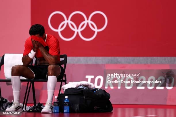 Omar Elwakil of Team Egypt sits looking dejected after losing the Men's Semifinal handball match between France and Egypt on day thirteen of the...