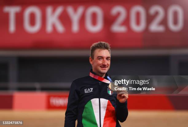 Bronze medalist Elia Viviani of Team Italy, poses on the podium during the medal ceremony after the Men's Omnium final of the track cycling on day...