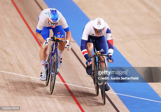 Matthew Walls of Team Great Britain crosses the finish line as he celebrates winning a gold medal ahead of Elia Viviani of Team Italy during the...