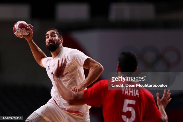 Nikola Karabatic of Team France shoots at goal as Yahia Omar of Team Egypt defends during the Men's Semifinal handball match between France and Egypt...