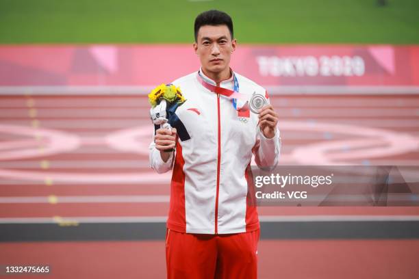 Silver medalist Zhu Yaming of Team China celebrates on the podium during the medal ceremony for the Men's triple jump on day thirteen of the Tokyo...