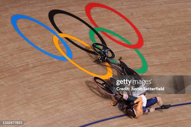 Laurine van Riessen of Team Netherlands and Katy Marchant of Team Great Britain fall during the Women's Keirin quarterfinals - heat 1 of the track...