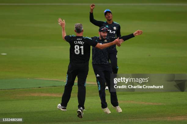 Rikki Clarke of Surrey celebrates with team mate Mark Stoneman after taking the wicket of James Hildreth of Somerset during the Royal London Cup...