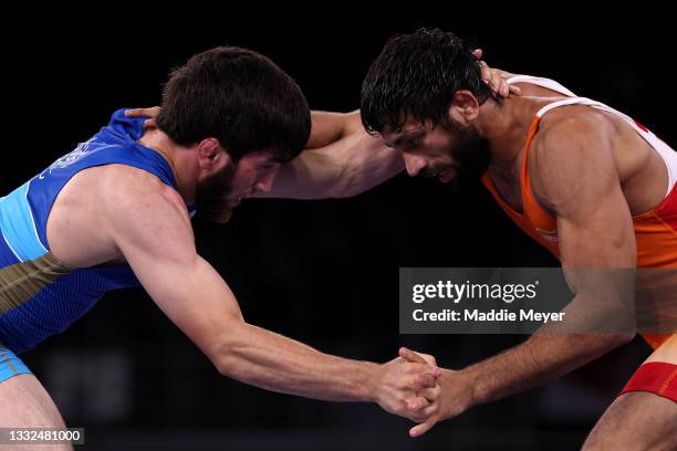 Zavur Uguev of Team ROC competes against Kumar Ravi of Team India during the Men's Freestyle 57kg Final on day thirteen of the Tokyo 2020 Olympic...