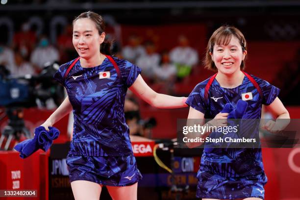 Ishikawa Kasumi and Hirano Miu react during their Women's Team Gold Medal table tennis match on day thirteen of the Tokyo 2020 Olympic Games at Tokyo...