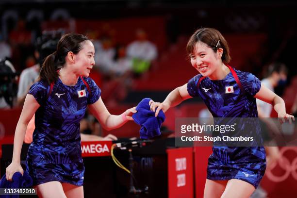 Ishikawa Kasumi and Hirano Miu react during their Women's Team Gold Medal table tennis match on day thirteen of the Tokyo 2020 Olympic Games at Tokyo...