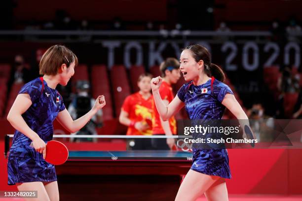 Hirano Miu and Ishikawa Kasumi react during their Women's Team Gold Medal table tennis match on day thirteen of the Tokyo 2020 Olympic Games at Tokyo...