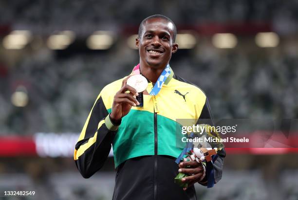 Bronze medalist Ronald Levy of Team Jamaica holds up his medal on the podium during the medal ceremony for the Men’s 110m Hurdles on day thirteen of...