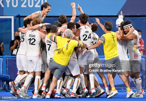 The Belgian players celebrate victory after winning the gold medal final match between Australia and Belgium on day thirteen of the Tokyo 2020...