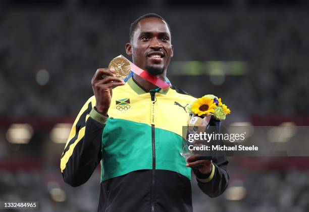 Gold medalist Hansle Parchment of Team Jamaica holds up his medal on the podium during the medal ceremony for the Men’s 110m Hurdles on day thirteen...