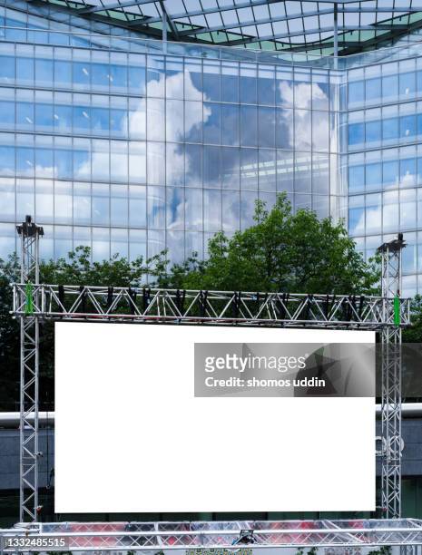 blank advertising screen against modern office building - vertical billboard stock pictures, royalty-free photos & images